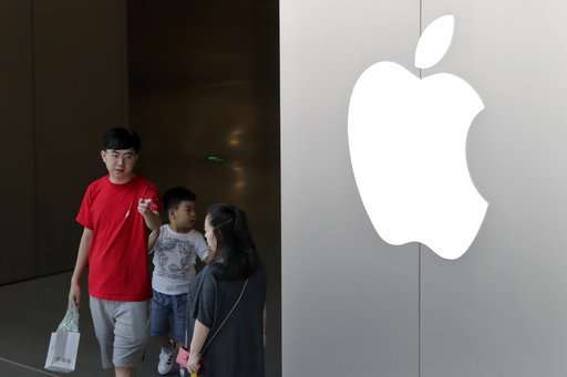Workers at iPhone supplier in China protest unpaid bonuses
