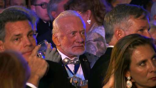 Astronaut Buzz Aldrin rolls out the red carpet for Mars