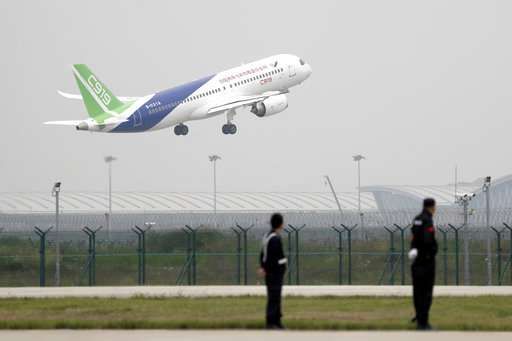 First large Chinese-made passenger jet makes its maiden flight