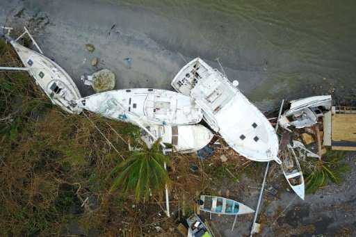 Hurricane Maria has devastated Puerto Rico's tourism industry—here, sailboats are seen washed ashore in Fajardo in September