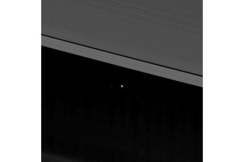 NASA image captures Earth between the rings of Saturn