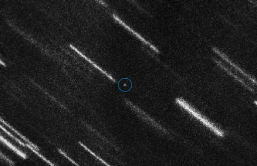 This handout picture released by the European Space Agency shows near Earth Asteroid 2012 TC4 appearing as a dot at the centre o