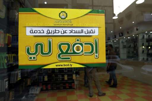 A  picture taken on July 24, 2017 shows a poster of the &quot;Edfali&quot; (Arabic for &quot;pay me&quot;) mobile phone app in a