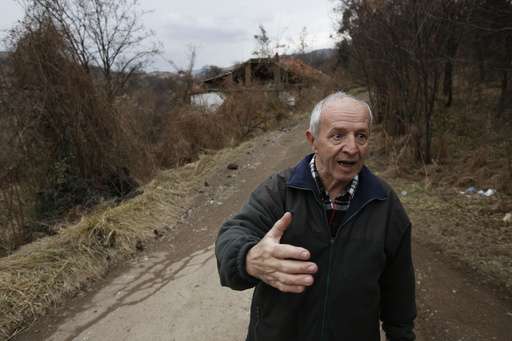 Lake created by coal waste landslide floods Bosnian highway