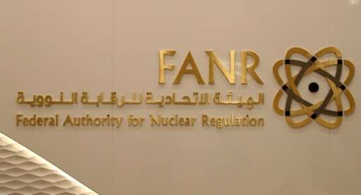 A picture taken on August 10, 2017 shows the sign and logo of the UAE's Federal Authority for Nuclear Regulation (FANR) at its p