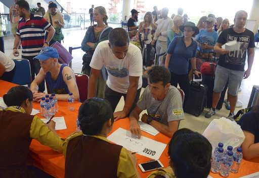 Bali volcano spits ash 2 ½ miles in the sky, airport closed