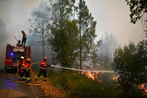 Firefighters battling blazes in central Portugal are worried about the hotter weather forecast, which increases the risk that ol