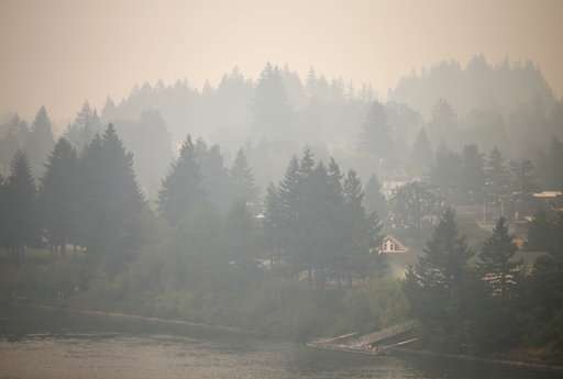 Wildfire smoke is choking the West but helping firefighters