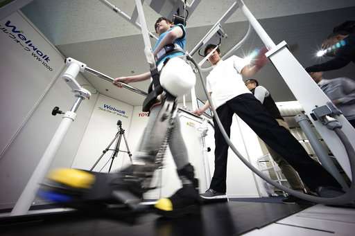 Toyota shows robotic leg brace to help paralyzed people walk