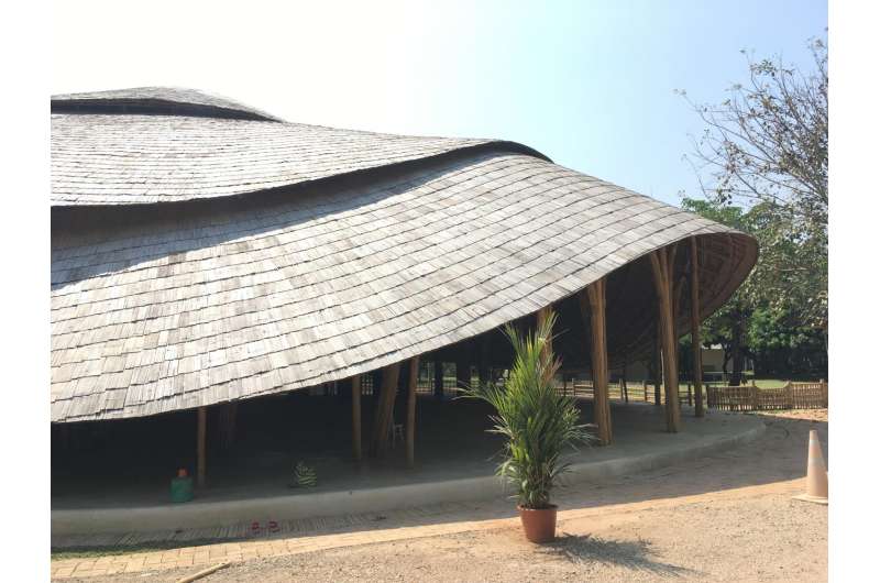 Sports hall for school in Thailand has bamboo construction
