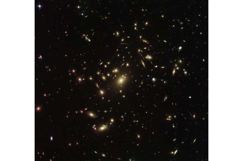 Hubble sees galaxy cluster warping space and time