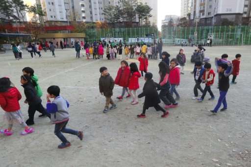 South Korean children heading to a shelter after the 5.4-magnitude earthquake struck