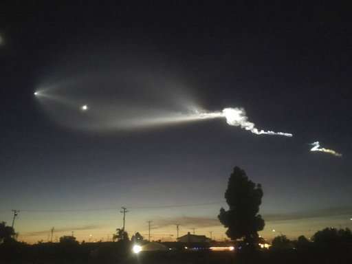 SpaceX rocket lights sky as it carries satellites from California
