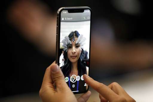 The Latest: Analysts notes potential for iPhone X features