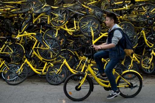 A booming rental bike business has flooded China's streets with packs of cyclists, but their habit of going the wrong way and ab