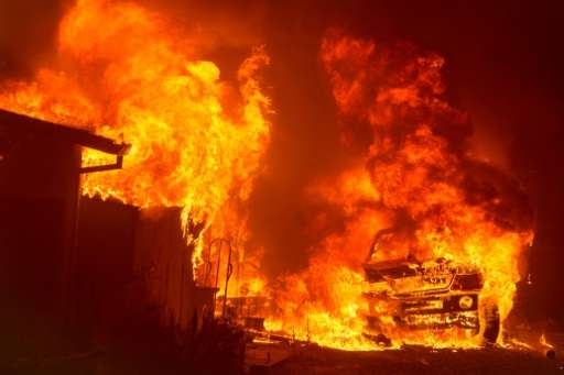 A car and house were engulfed in flames as a wildfire burnt through a residential area in Oroville, California earlier this mont
