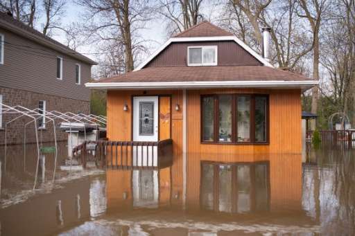 A flooded home in the Montreal borough of Pierrefonds. Floods and heavy rains have led to evacuations and caused extensive damag