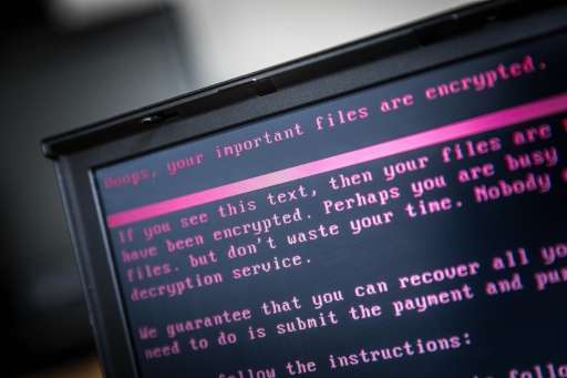 A laptop displays a message demanding payment for unlocking files encrypted by the ransomware attack that spread from Ukraine an