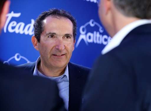 Altice USA, part of the telecom empire of French magnate Patrick Drahi—seen at a March 2017 press conference in Paris—raised som