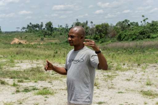 A member of the the Obung community speaks about the Cross River Super Highway, in Calabar, Nigeria