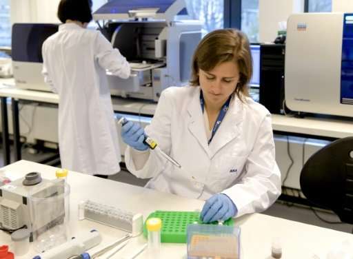 An employee works at the new state-of the-art DNA laboratory of the International Commission on Missing Persons, in The Hague, o