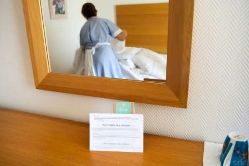 A notice asks guests whether they want linens to be changed, at a five-star hotel in the resort town of Ayia Napa in south-easte