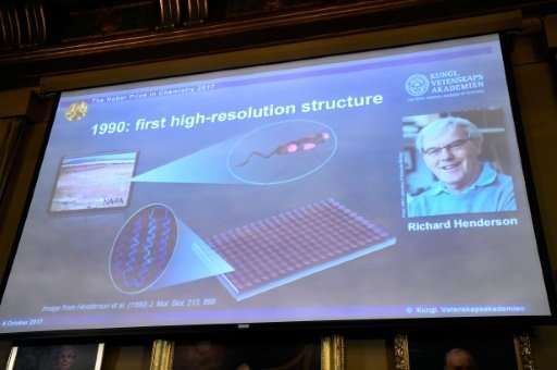 A picture of Richard Henderson shown at the Nobel announcement on a screen displaying details of his work