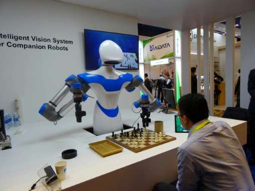 A robot developed by Taiwan's Industrial Technology Research Institute plays chess at the Consumer Electronic Show in Las Vegas,