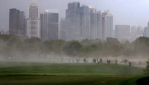 A sandstorm sweeps across the fairway during second round of the Dubai Desert Classic at the Emirates Golf Club in Dubai on Febr
