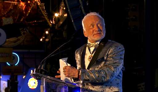 Astronaut Buzz Aldrin rolls out the red carpet for Mars