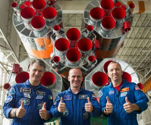 Astronaut Randy Bresnik (R), astronaut Paolo Nespoli (L) and Russian cosmonaut commander Sergei Ryazansky (C) are due to blast o