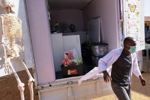 A technician with the &quot;Science on Wheels&quot; truck at a school in Nigeria's Katsina state, where only about a fourth of s