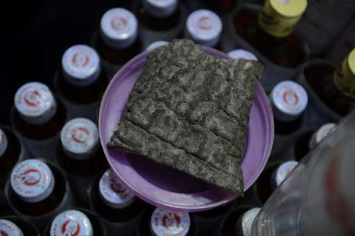 At Myanmar's &quot;Golden Rock&quot; slices of skin from the country's fast disappearing wild elephants are sold as a cure for s