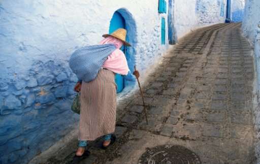 A woman walks in the medina of the northwestern Moroccan city of Chefchaouen