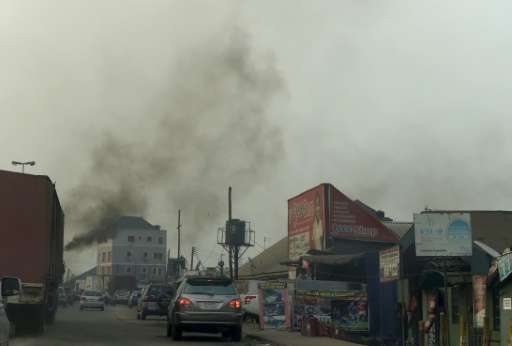Black smoke pollutes the air in the Nigerian city of Port Harcourt