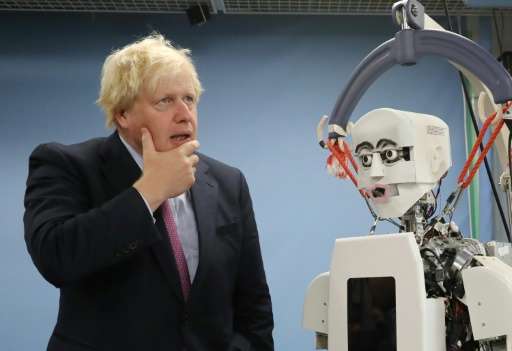 Britain's Foreign Secretary Boris Johnson visits the robotic centre at Waseda University, which works closely with Britain's Uni