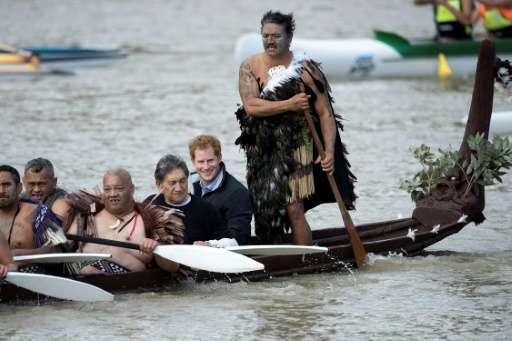 Britain's Prince Harry (2nd R) took a canoe ride along the Whanganui river, the third longest in New Zealand, on a trip to the c