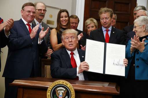 Calling it a beginning, Trump signs health care order