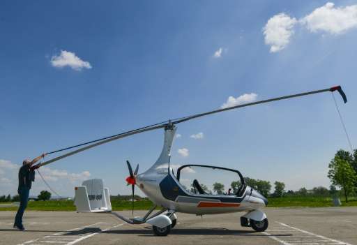 Czech pilot Pavel Brezina (L), owner of Nirvana Autogyro company, has made a &quot;GyroDrive&quot;—a mini helicopter you can dri
