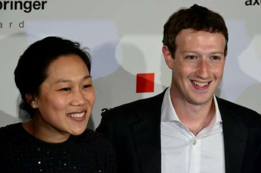 Facebook co-founder and CEO Mark Zuckerberg and his wife Priscilla Chan, shown in this 2016 file photo, said they hope baby Augu