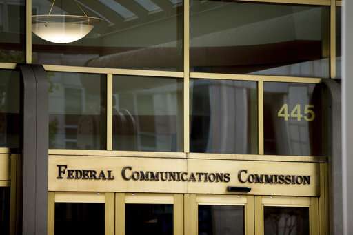 FCC relaxes limits on owning newspapers, TV stations