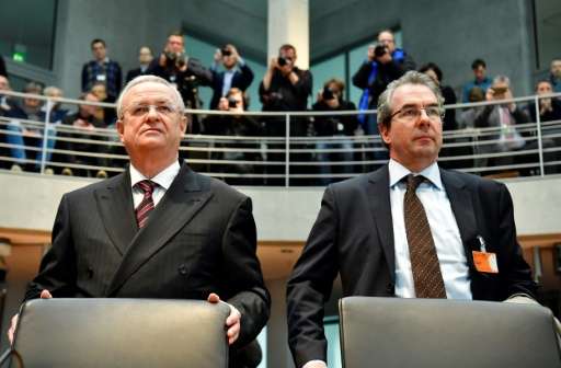 Former Volkswagen boss Martin Winterkorn (L) and VW manager Gerwin Postel pictured before taking their seats inside the Bundesta