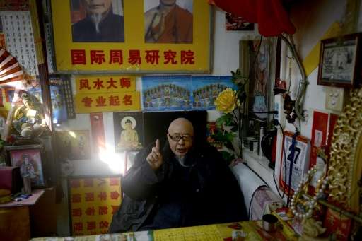 Fortune teller Mao Shandong waits for customers at his shop in Beijing. Chinese have for centuries believed that a well-chosen n