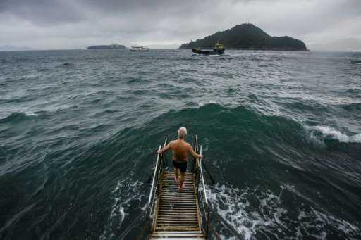 Hong Kong's Victoria Harbour is one of the world's busiest ports, but every morning daring elderly swimmers dive in to its chopp