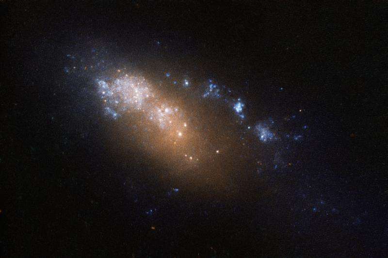 Hubble’s dwarf-sized, double-named galaxy