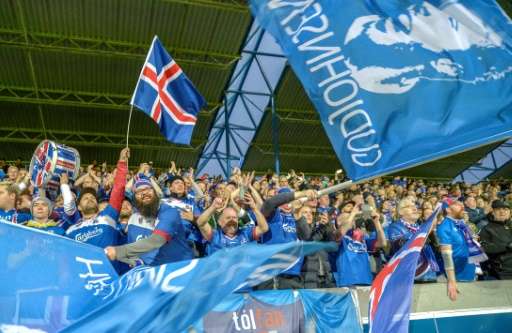 Icelandic football fans cheer their team during the FIFA World Cup 2018 qualification football match between Iceland and Ukraine