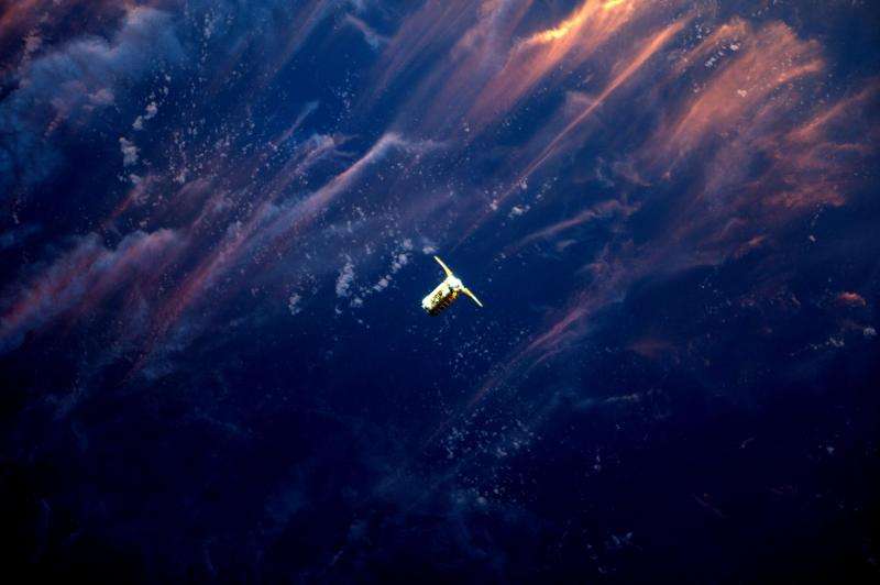 Image: Cygnus spacecraft approaches ISS in the sunset