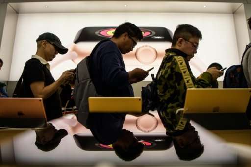 In Hong Kong, buyers who had pre-ordered the phone online queued to pick up their new purchases, saying they were willing to pay