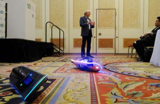 Inventor and CEO of Hoverboard Technologies, Robert Bigler unveils his GeoBlade transporter at the Consumer Electronics Show on 