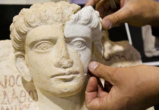 Italian teams restore damaged busts from ancient Syrian city